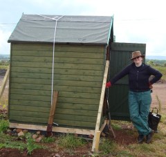 SB standing beside the allotment shed